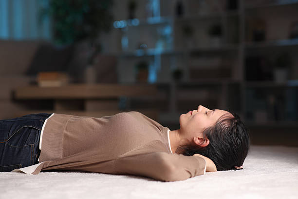 Person relaxing with guided breathing before sleep